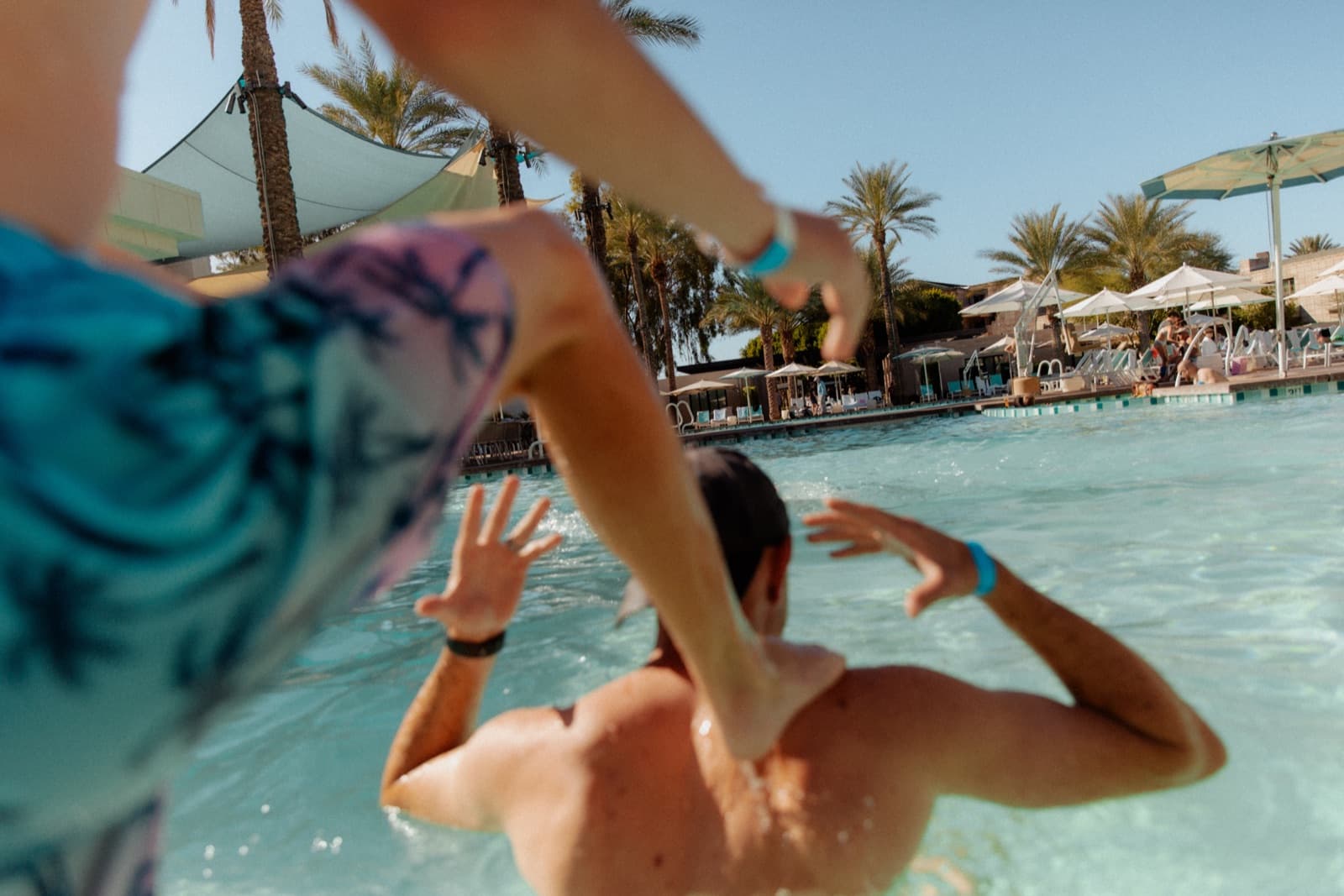 Guests relaxing by a resort pool