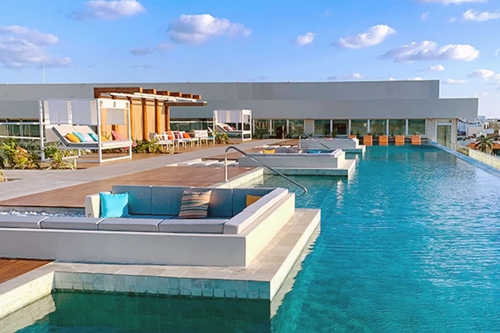 Lounge beds surrounded the rooftop pool at Aloft Playa del Carmen