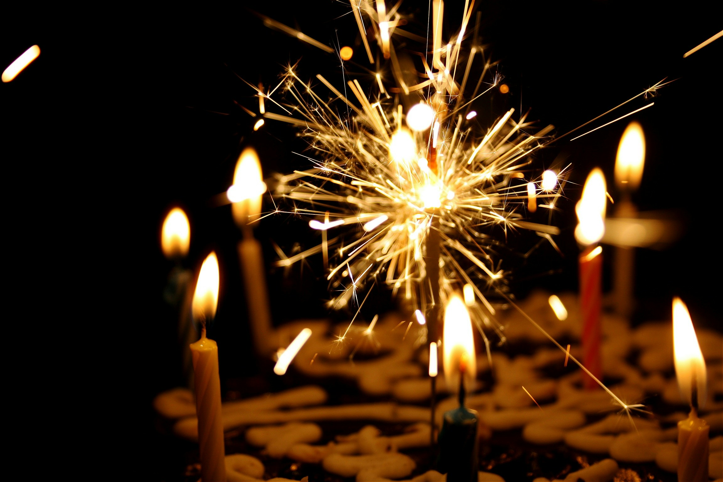 Sparkler candles on a birthday cake.