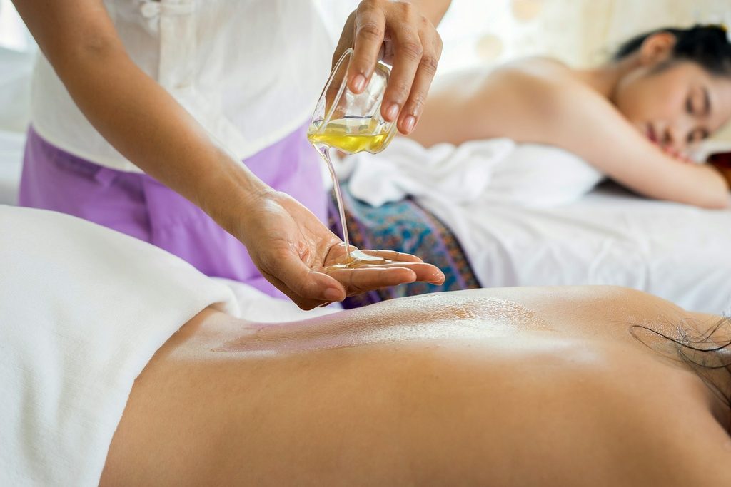Woman receiving a massage at a hotel spa