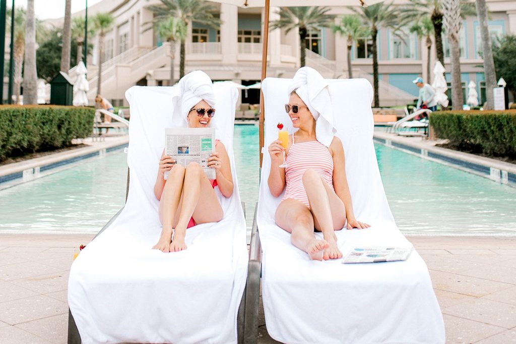 Guests lounging poolside at Waldorf Astoria Orlando